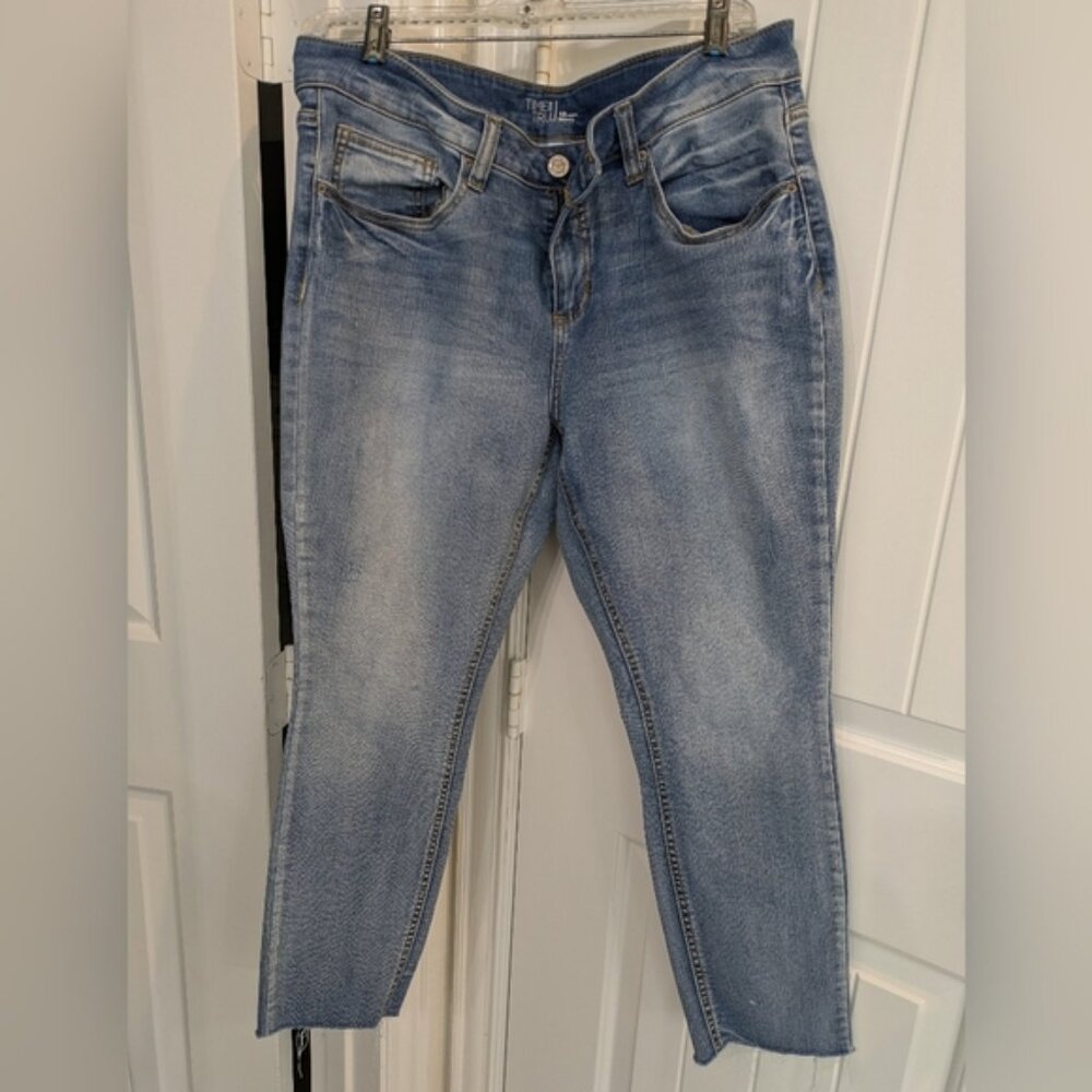 Light wash skinny jeans with raw hem, size 18 petite